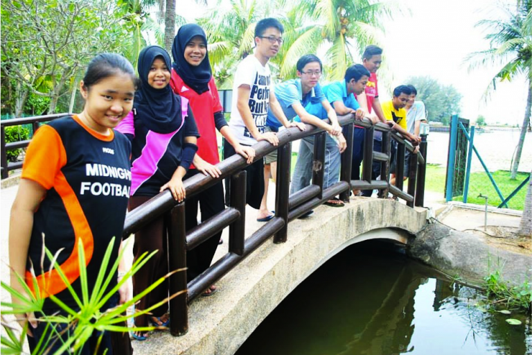 MF participants pose on a bridge
