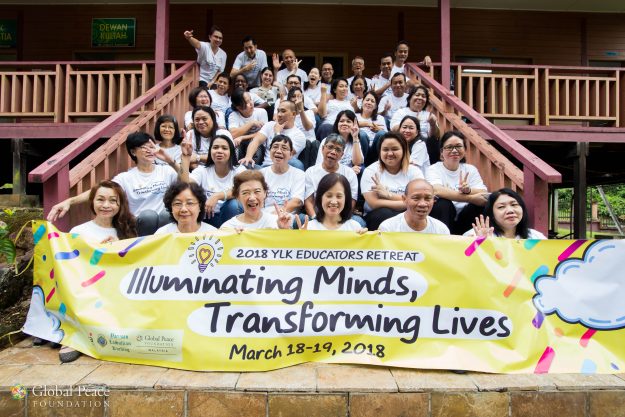 27191691998_6cfc8e72dd_o participant's pose with retreat banner