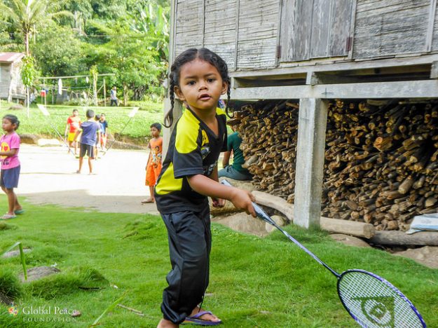 Orang asli child playing badminton in Ulu Geroh