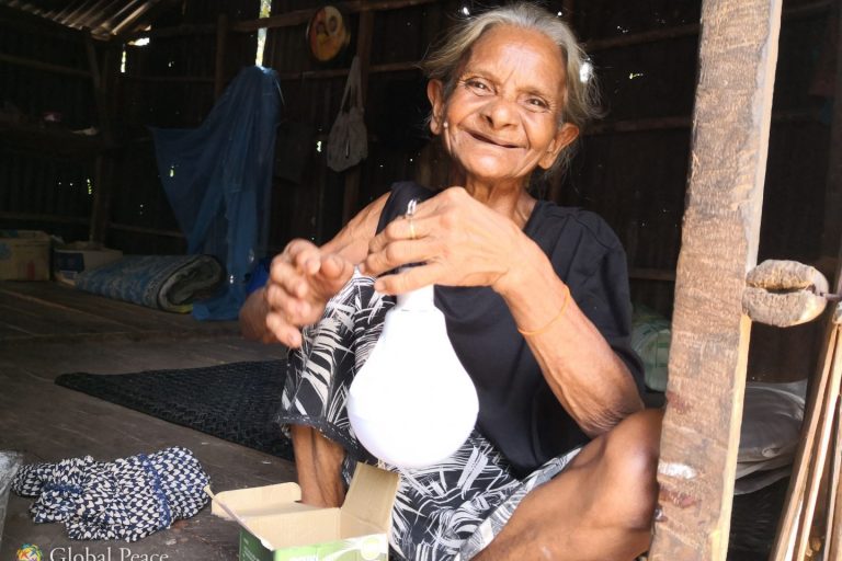 Nenek Jamilah showing us her USB lamp that she purchased from a peddler that comes to her village every few days. Nenek Jamilah showing us her USB lamp that she purchased from a peddler that comes to her village every few days.