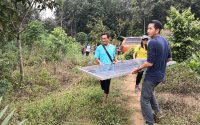 Setting up the station and solar panel at the station manager's house.