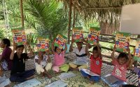 kids holding book up