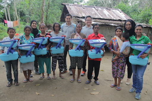 Nestlé team (in Green) visiting Kampung in 2018, providing water filters as part of their CSR initiative part two